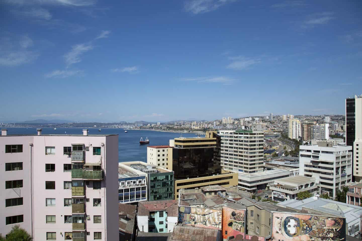 An overhead view of many buildings and the water in Valparaiso, Chile