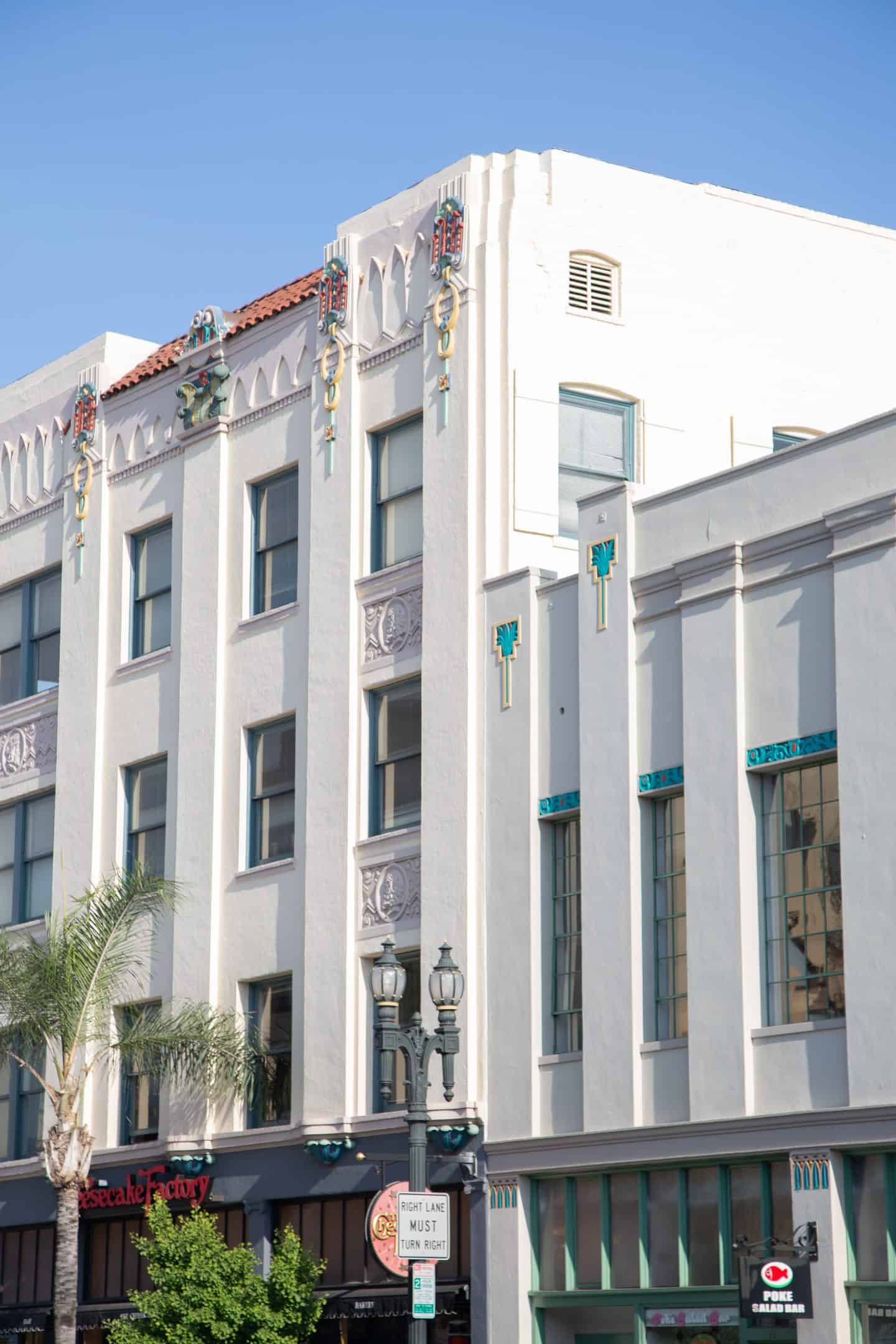 A tall white building with introduce blue and yellow details in Pasadena, California.