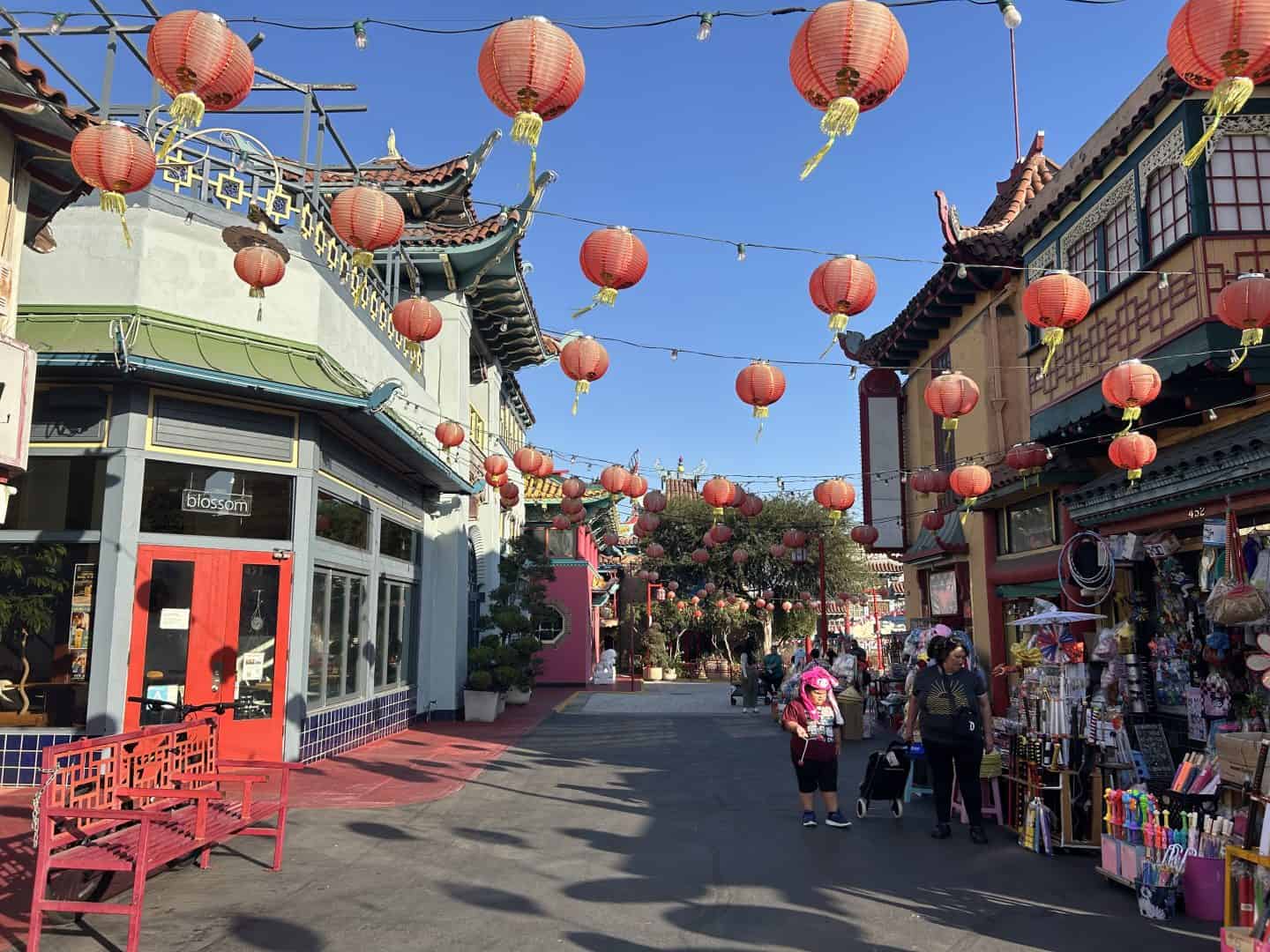a street with red lanterns and buildings in Chinatown, Los Angeles