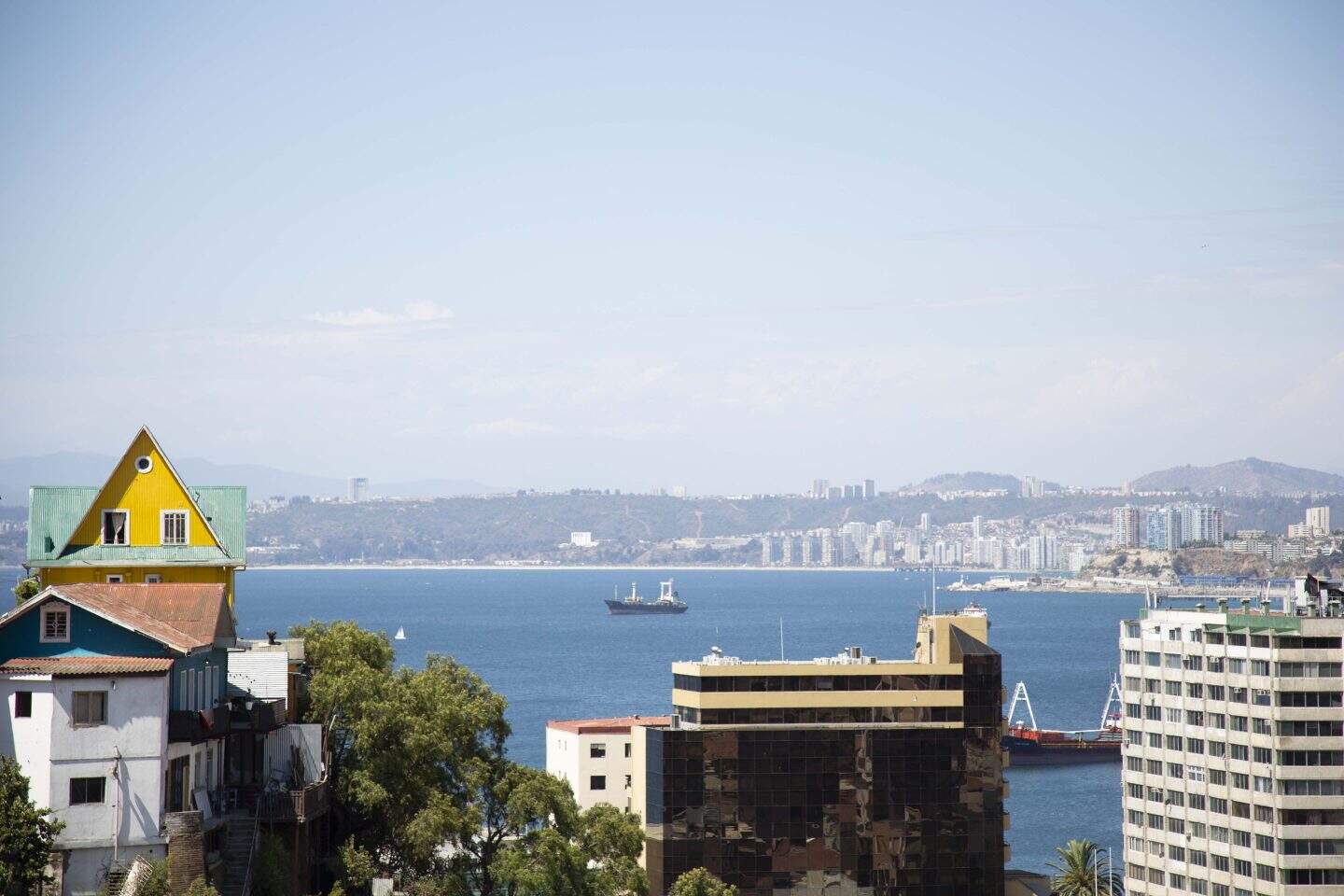 A view of the Pacific Ocean with boats and buildings in Valparaiso, Chile