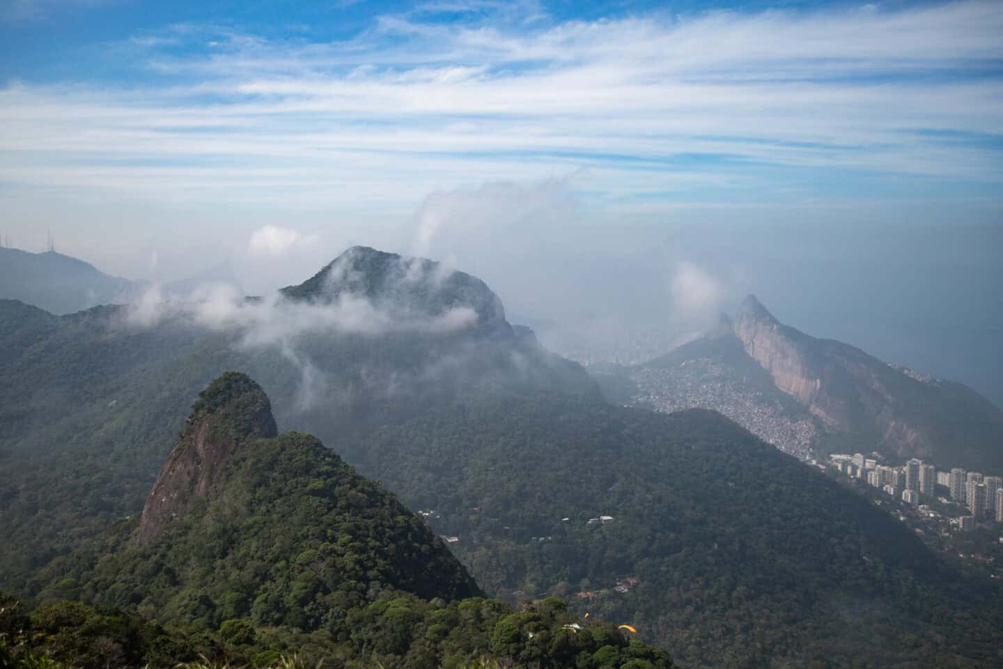 Mountains and clouds visible from Pedra Bonita, a hike in Tijuca Forest, Rio de Janeiro.