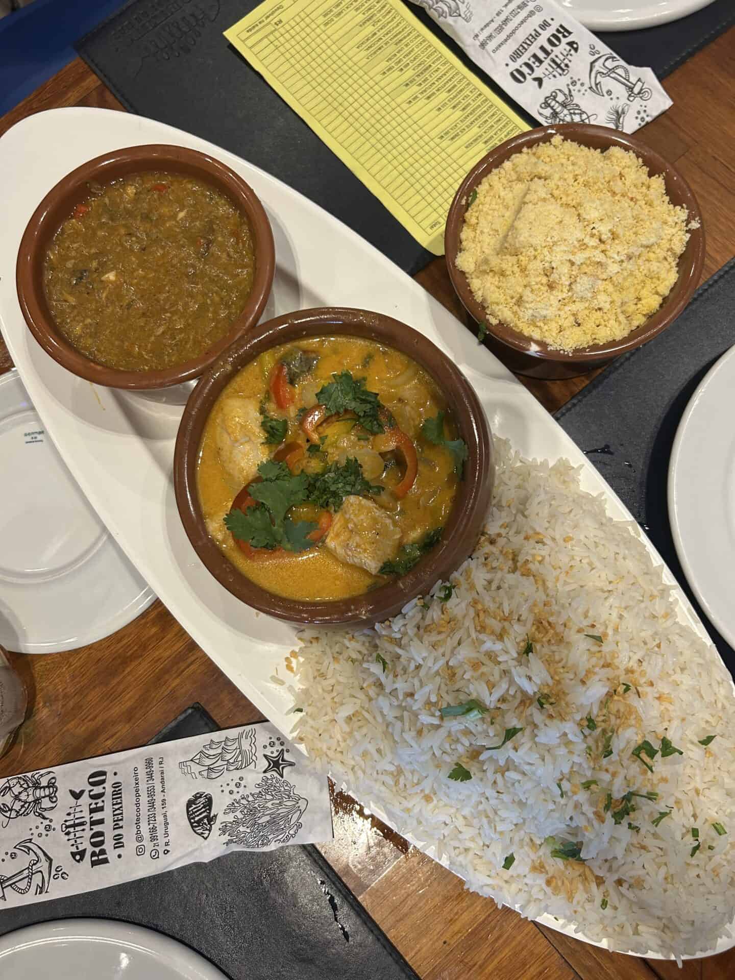 Moqueca, white rice, farofa, pirao, in Rio de Janeiro.