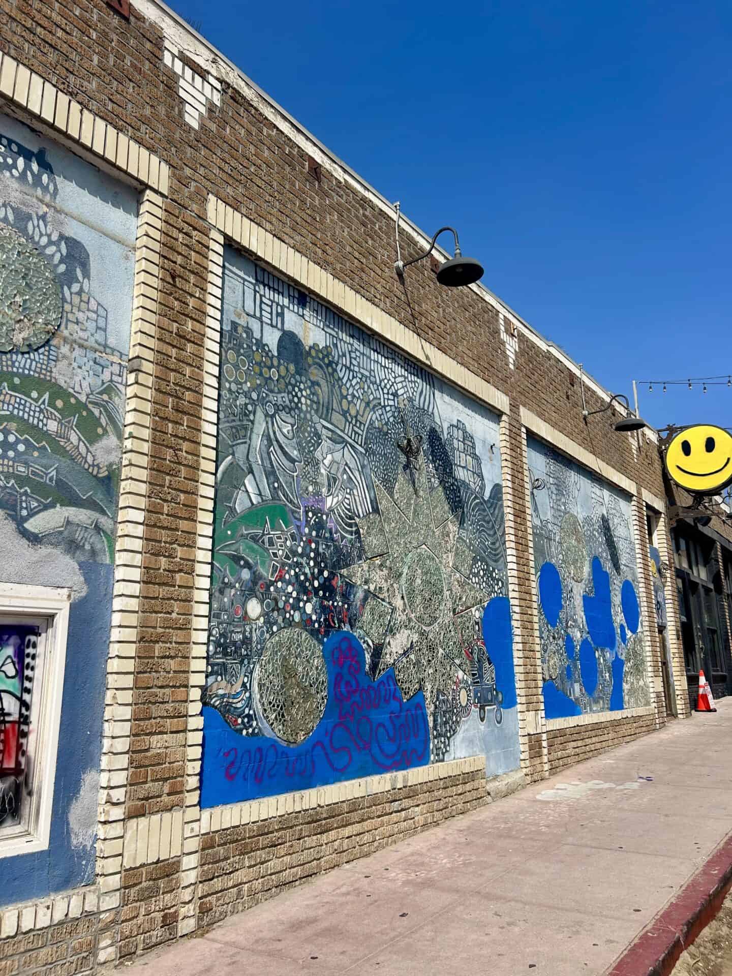 Building on Venice Boardwalk with silver and blue mosaic.