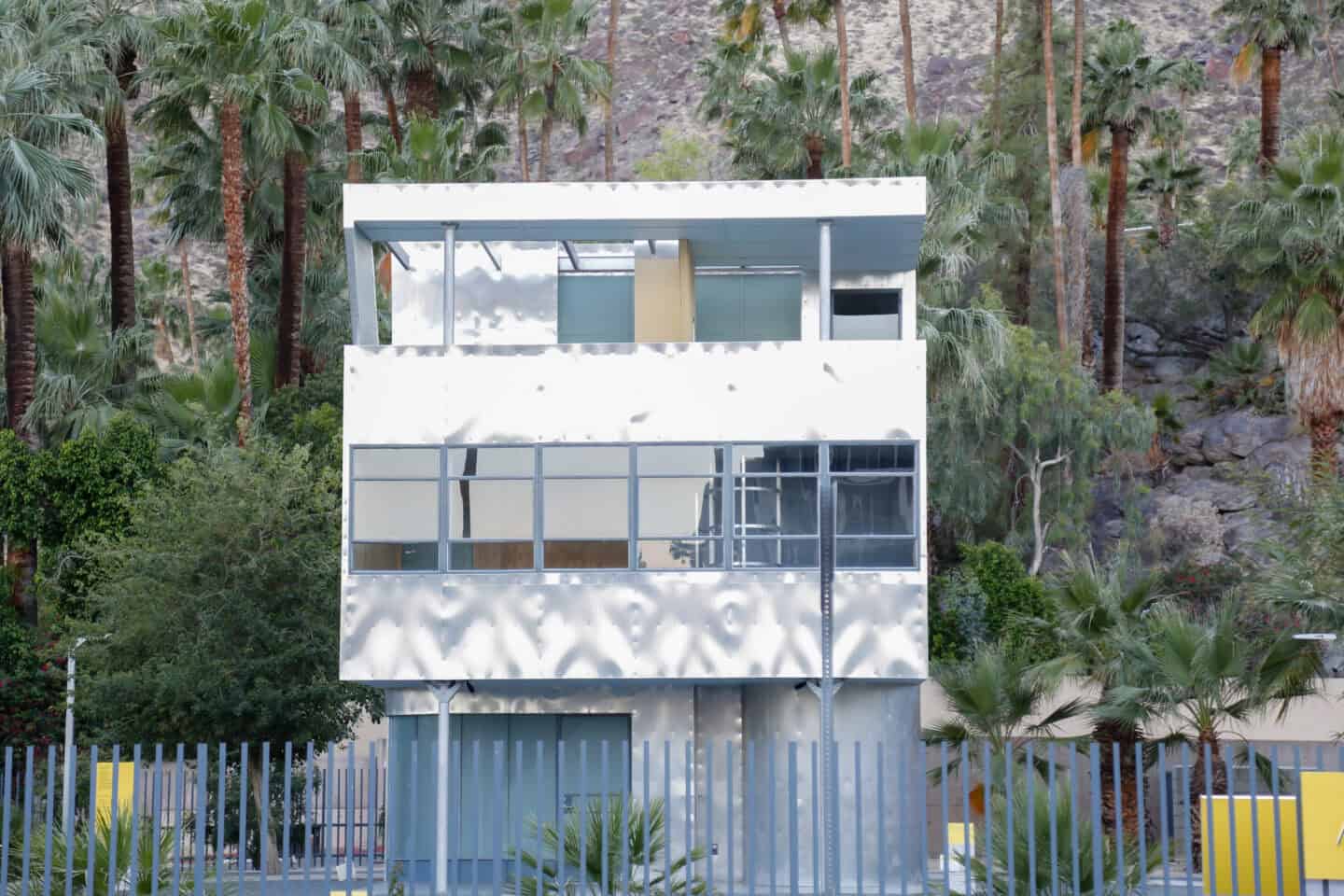 All-metal Aluminaure House surrounded by trees, and mountains in Downtown Palm Springs.