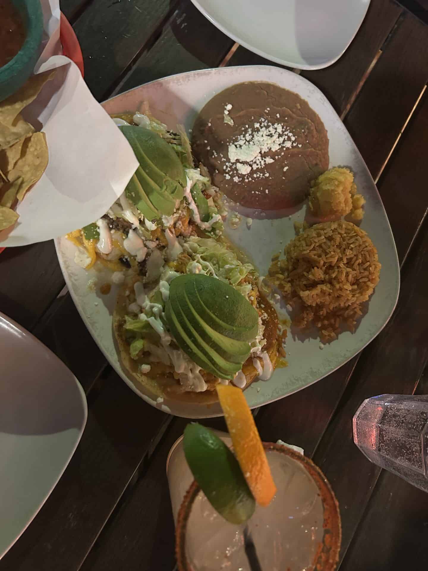 Open-faced enchiladas with avocado, rice, and beans, and a margarita from Las Maracas in downtown Palm Springs.