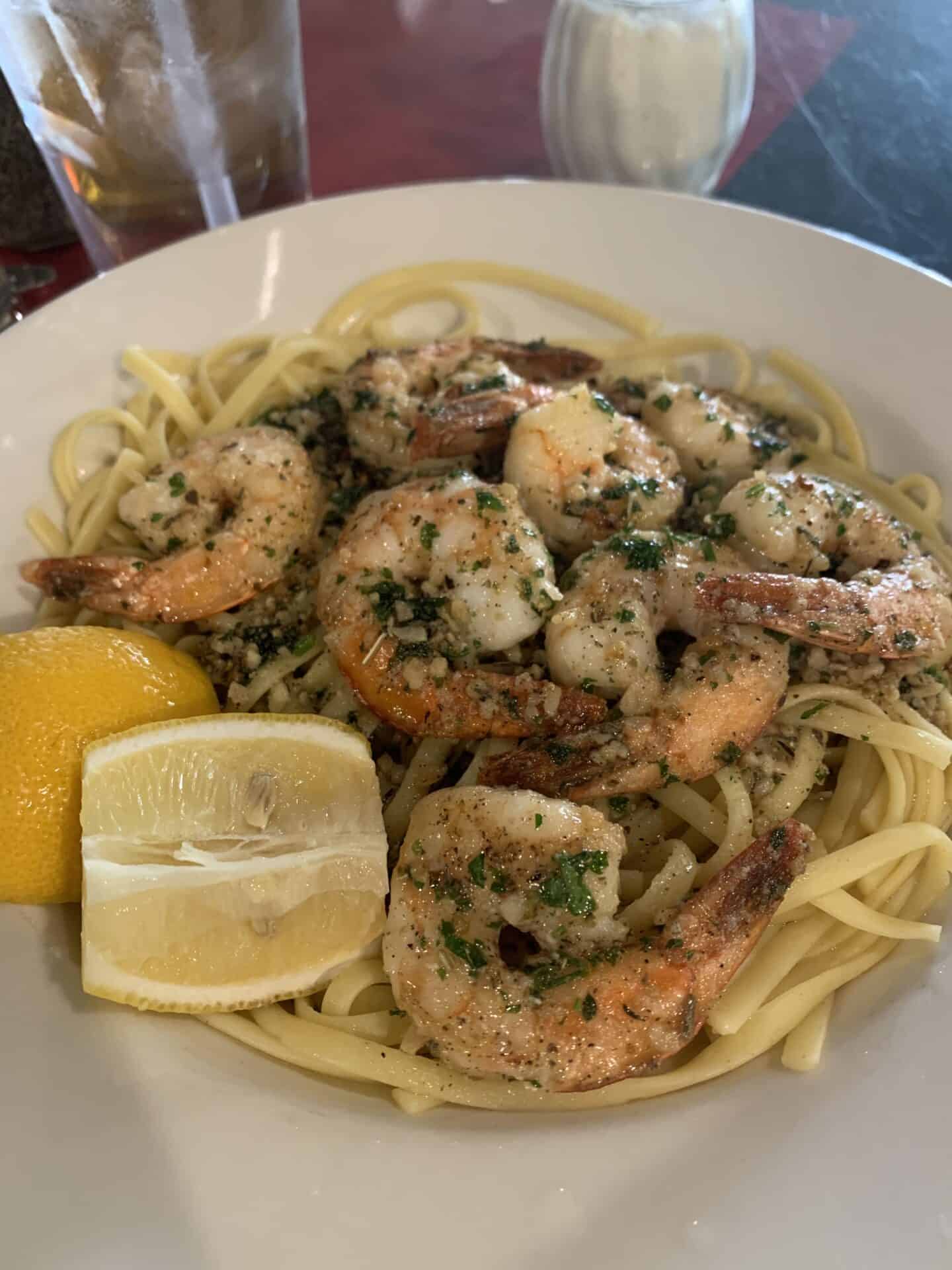 Pasta with shrimp and lemon wedges from Capri Italian Restaurant at Miracle Hot Springs Resort, near Palm Springs, California.