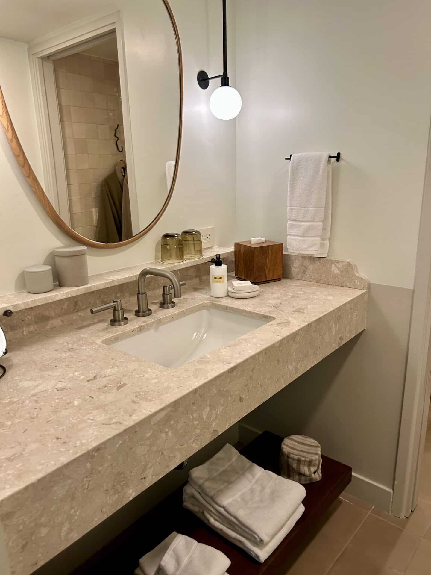 A large bathroom counter, with towels in Casa Loma Beach Hotel in Laguna Beach.