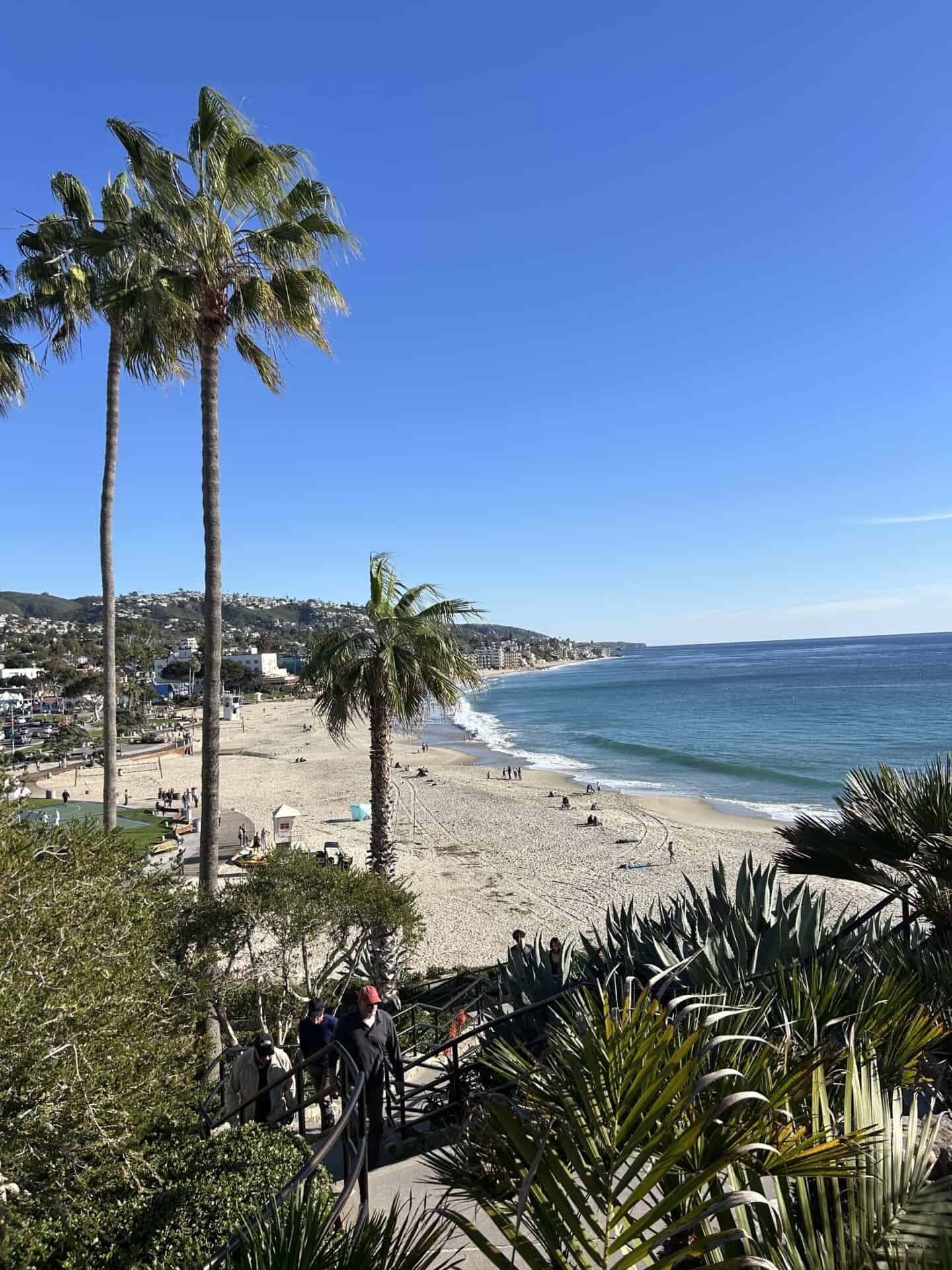Plant-lined stairs leading down from Casa Loma Beach Hotel in Laguna Beach toward Main Beach.