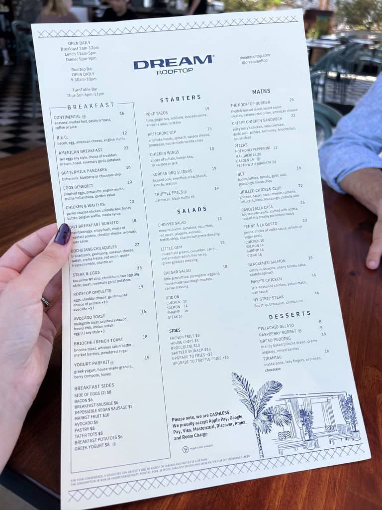 DREAM rooftop menu with breakfast, starters, salads, mains, and desserts at Tess the Traveler.