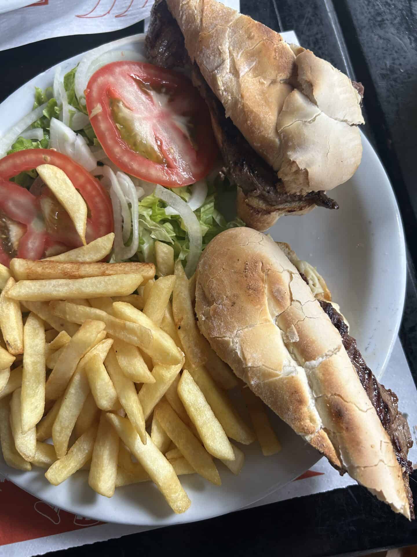 A steak sandwich with vegetables and fries from Jóia Carioca restaurant, in the Jardim Botânico neighborhood of Rio de Janeiro.