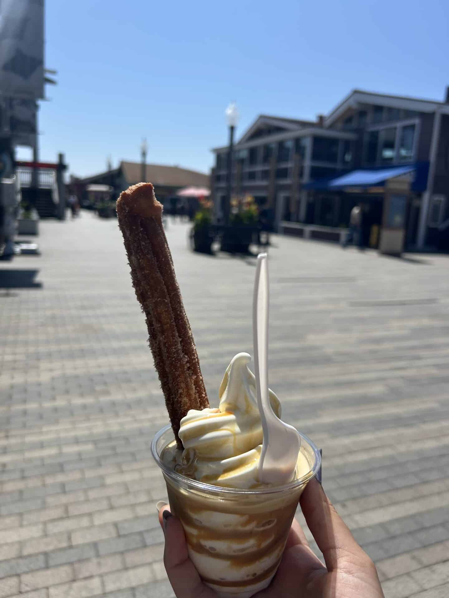 Soft ice cream with caramel and a churro, purchased on the pier of Redondo Beach, California.